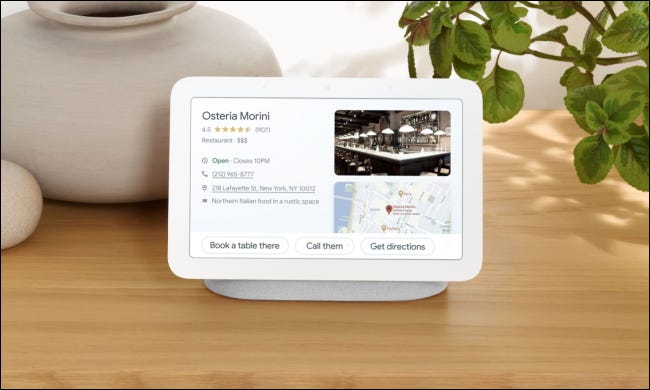 Google Nest hub on table with pots