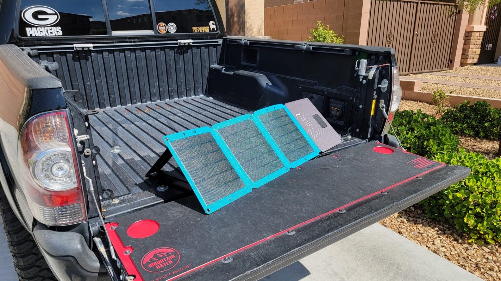 Anker 24w solar panels charging in the back of a truck