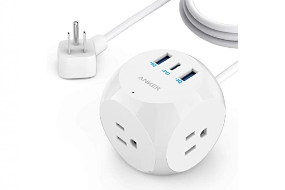 A white Anker Power Strip with various outlets and ports.